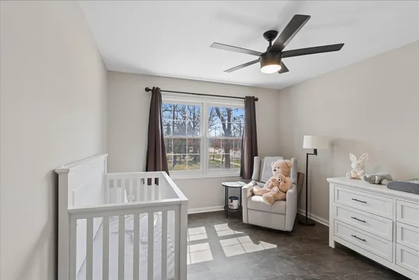 a bedroom with furniture and windows