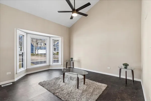 a living room with furniture and a rug