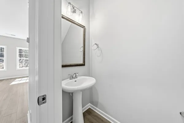 a bathroom with a sink and mirror