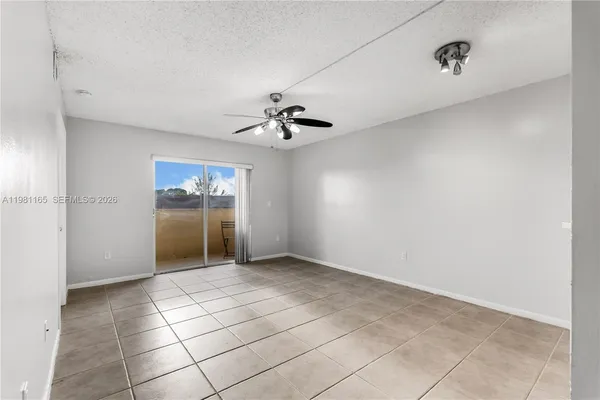 a view of an empty room with a bathroom