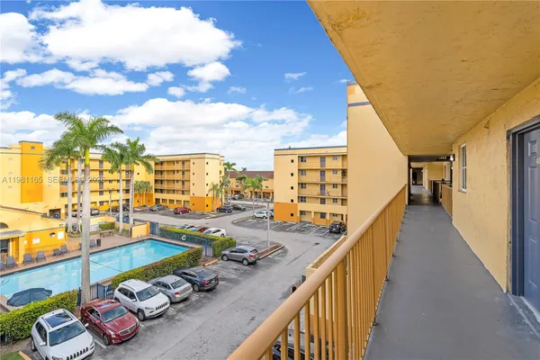 a view of swimming pool with outdoor seating