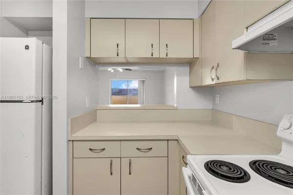 a bathroom with a sink washer and dryer