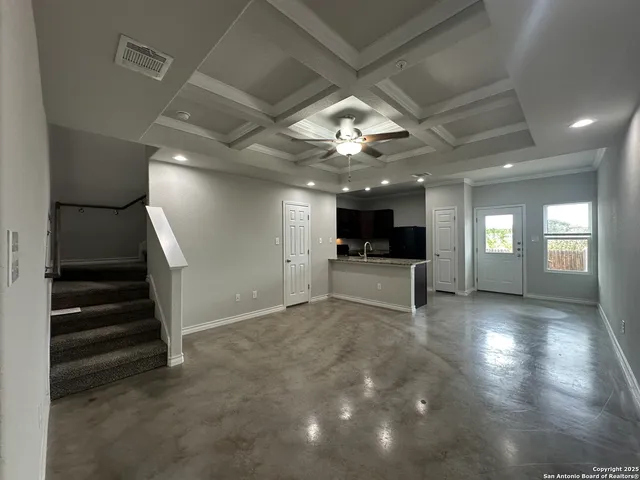a view of entryway and kitchen