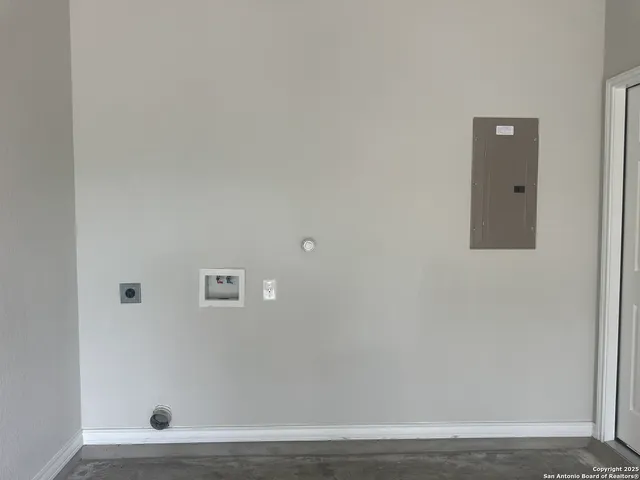 a view of a house with a small yard and wooden fence