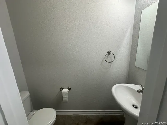 a bathroom with a toilet and a sink