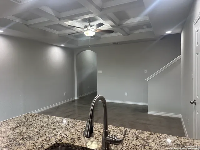 a view of a livingroom with furniture and chandelier