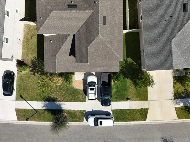 an aerial view of a house with swimming pool
