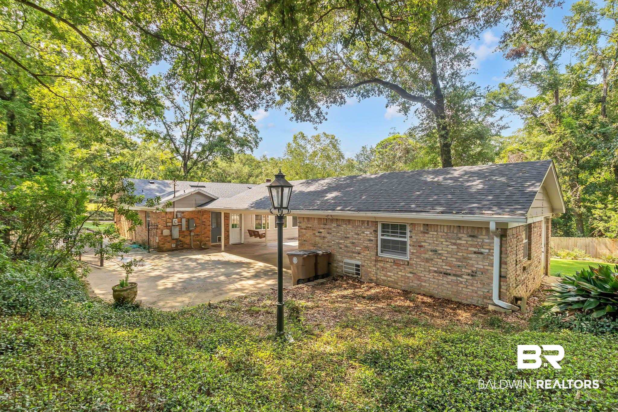 309 West Brandy Run Road Mobile, AL 36608 - Photo 77 of 100 Back of house with a patio area, brick siding, and roof with shingles