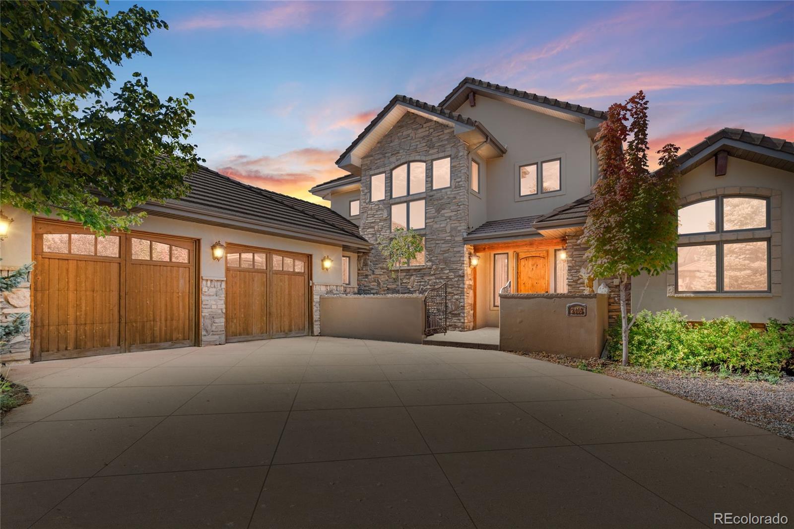 2416 Fossil Trace Drive Golden, CO 80401 - Photo 1 of 41 a front view of a house with a garage