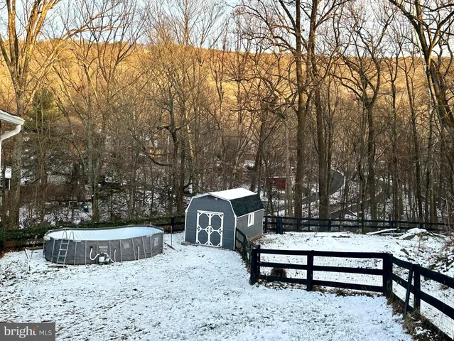a view of a backyard of the house