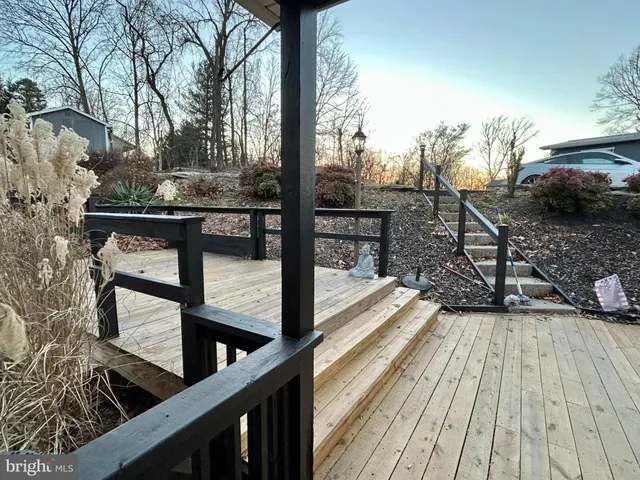 a view of snow with trees in the background