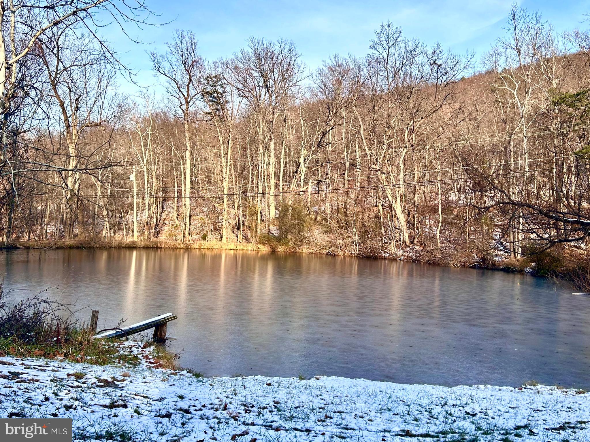 118 Roller Coaster Road Harpers Ferry, WV 25425 - Photo 4 of 56 a view of a lake with a mountain
