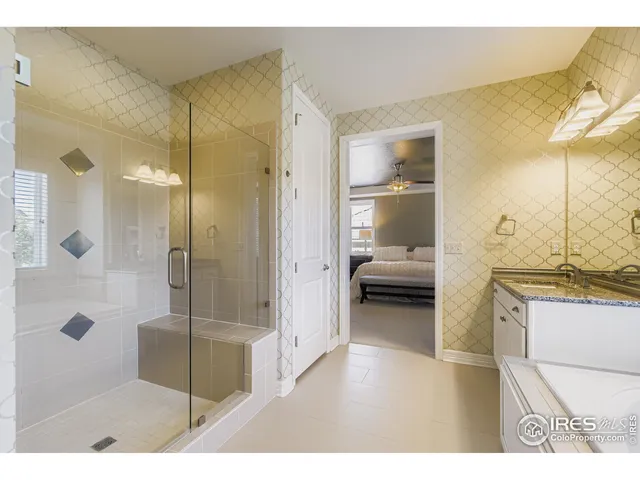 a bathroom with a tub and a shower