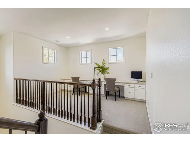 a view of a workspace with furniture
