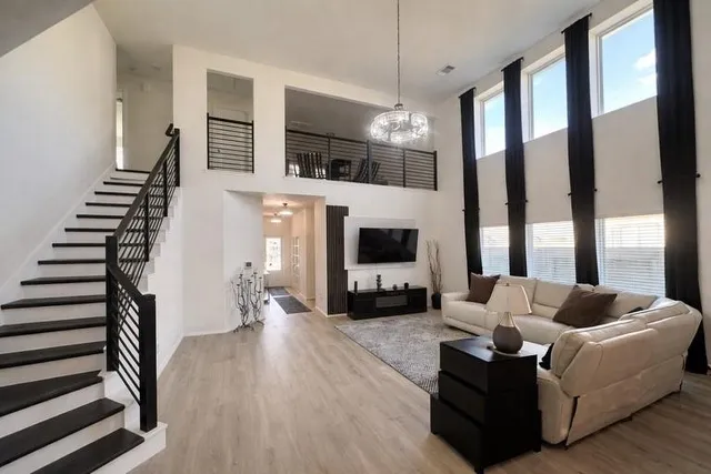 a living room with furniture fireplace and flat screen tv
