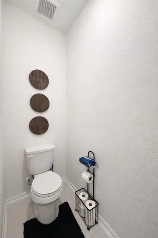 a bathroom with a toilet and a sink