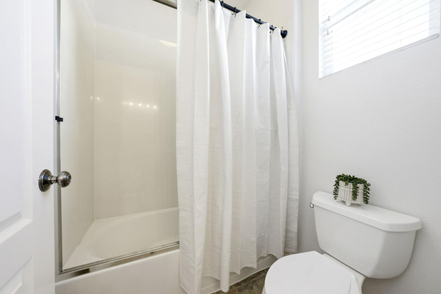 2556 Harlow Lane San Ramon, CA 94582 - Photo 45 of 62 a white toilet sitting next to a bathroom sink