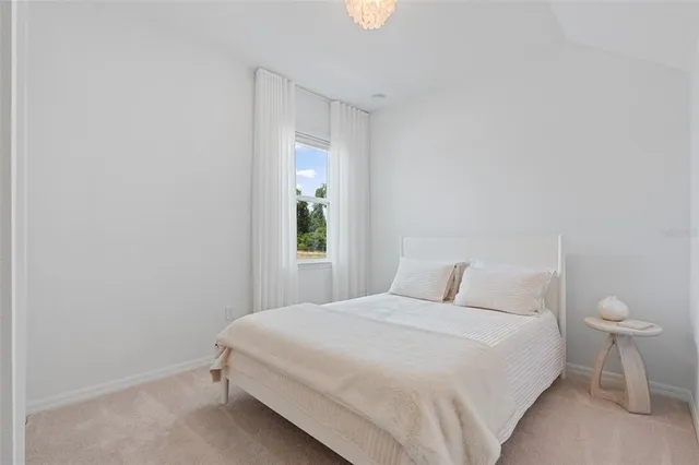 a bathroom with a sink a toilet and shower curtain