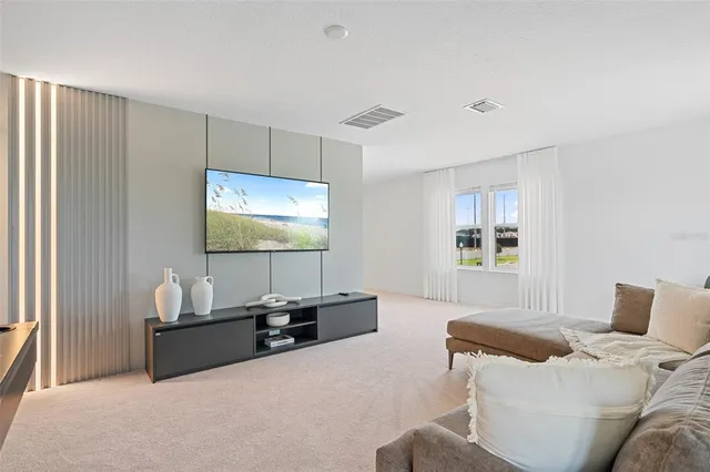 a living room with furniture and a table