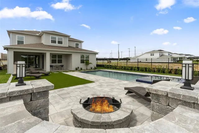 a aerial view of a house with swimming pool