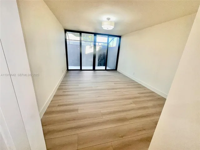 a spacious bathroom with a double vanity sink and a mirror