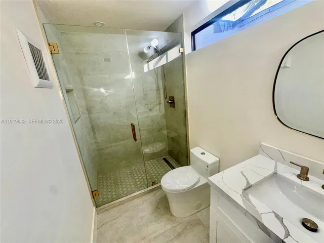 a view of hallway with wooden floor