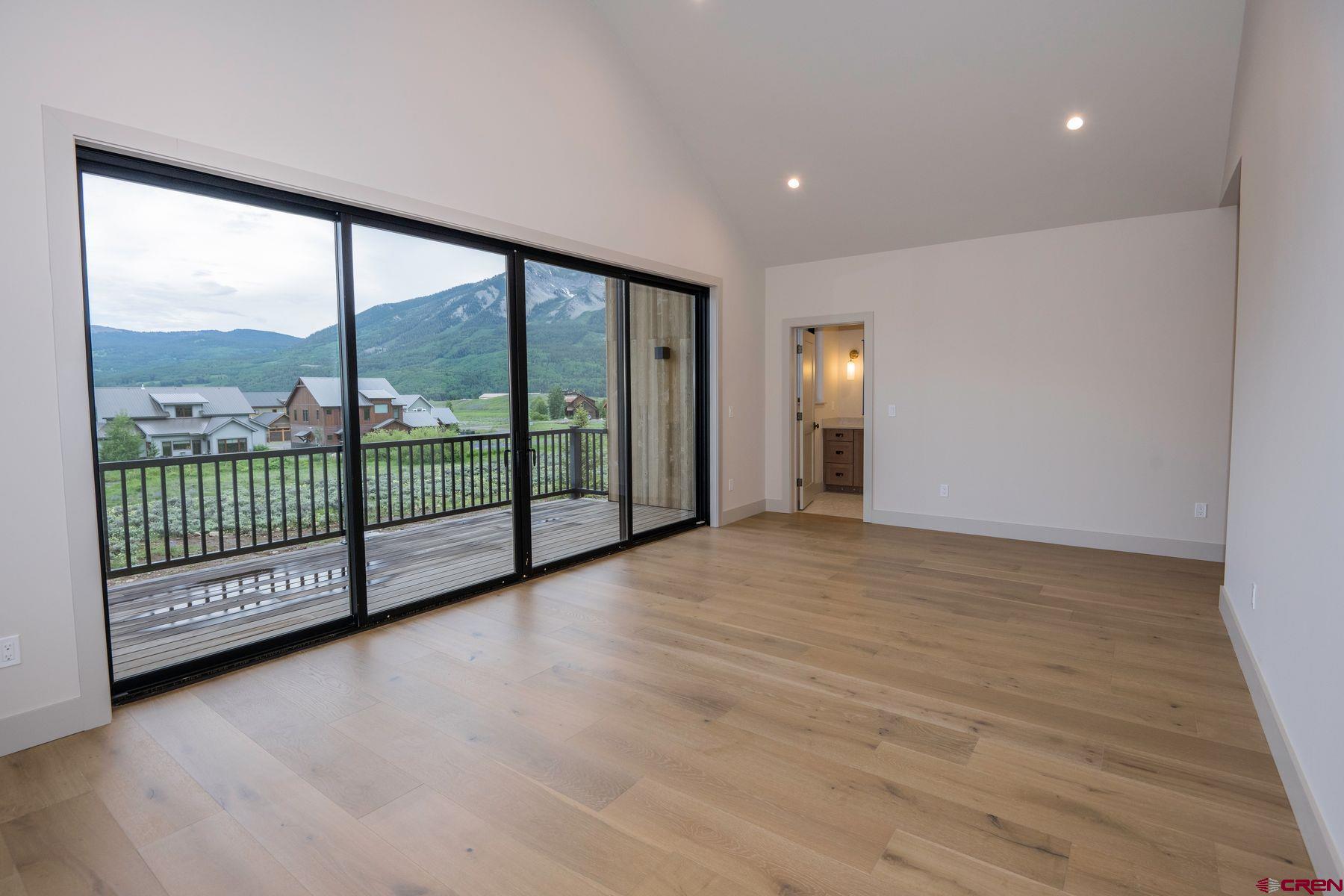 180 Elk Valley Road, Unit 113 Crested Butte, CO 81224 - Photo 13 of 35 a view of a room with an empty space and balcony