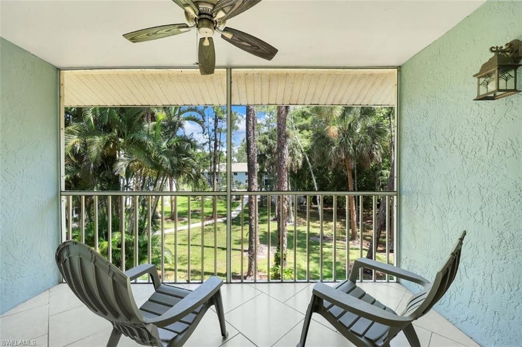 5685 Whitaker Road, Unit 202 Naples, FL 34112 - Photo 21 of 26 Large screened in Lanai looking out to the pool