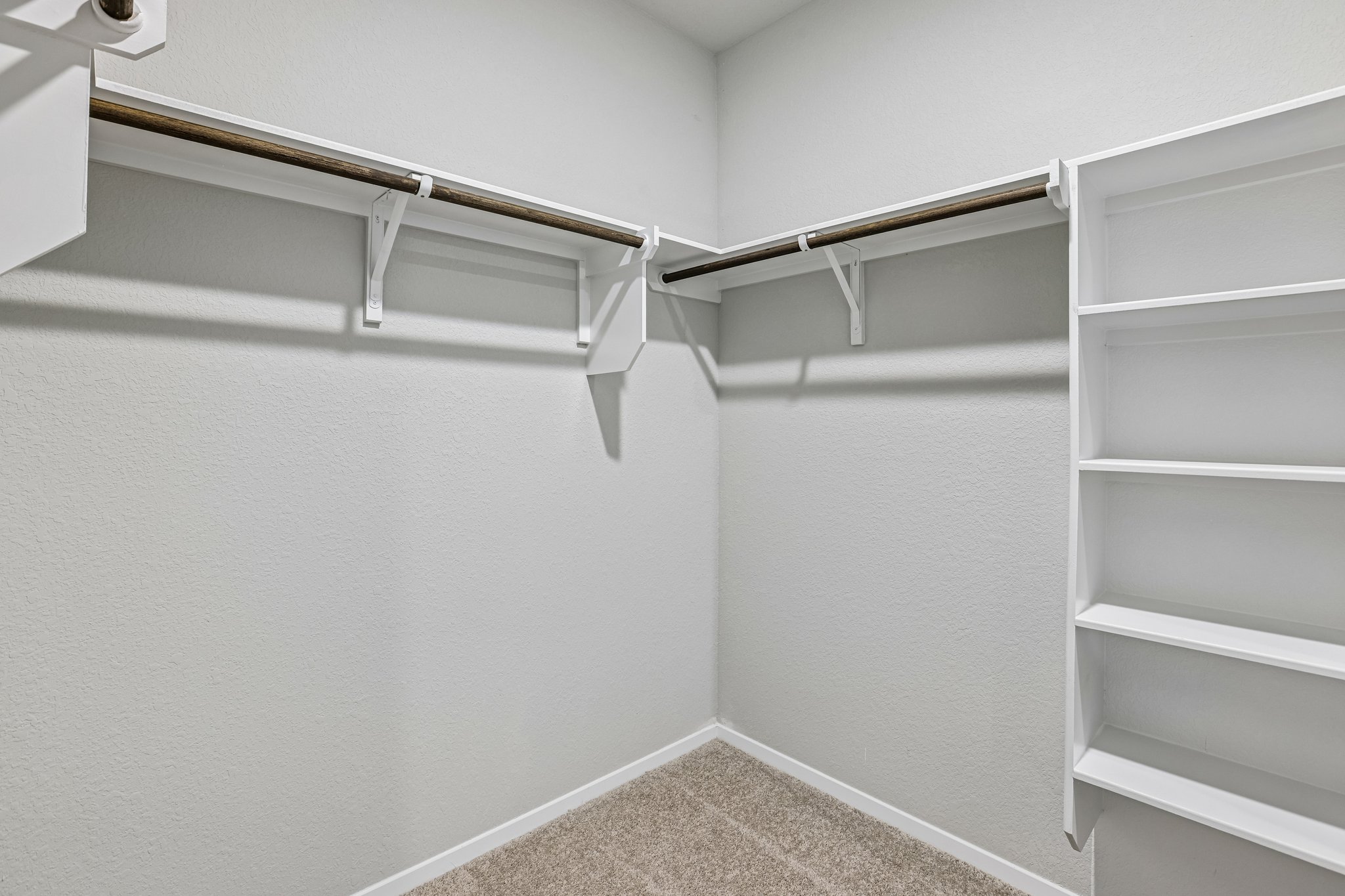 5513 Sacra Cove Austin, TX 78747 - Photo 23 of 37 a view of an empty walk in closet