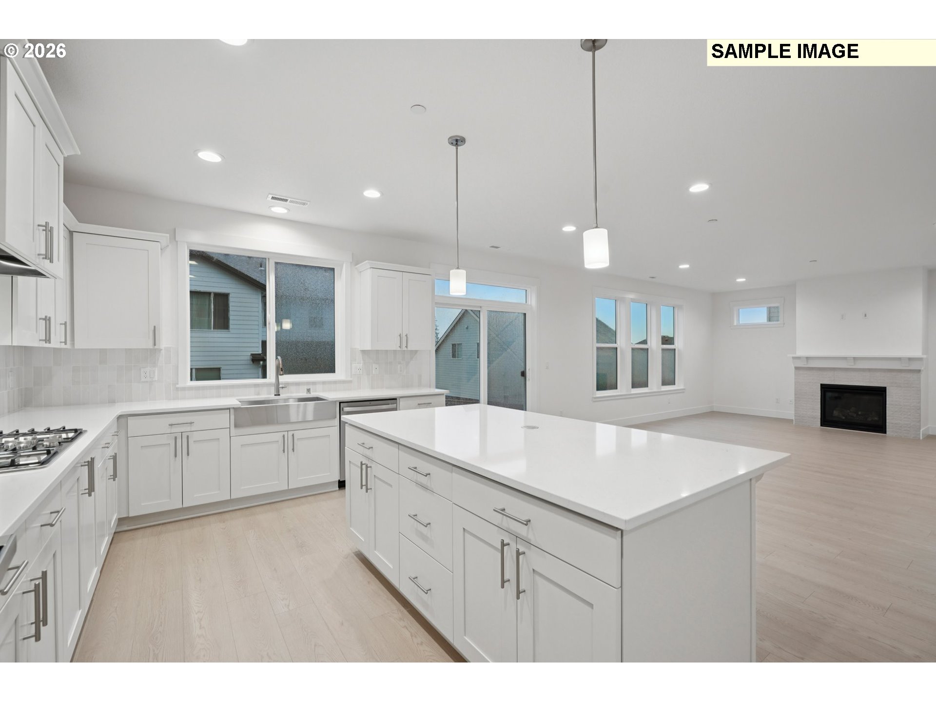 9302 North Clover Street, Unit LOT 267 Camas, WA 98607 - Photo 11 of 33 a large kitchen with kitchen island a sink stainless steel appliances and cabinets