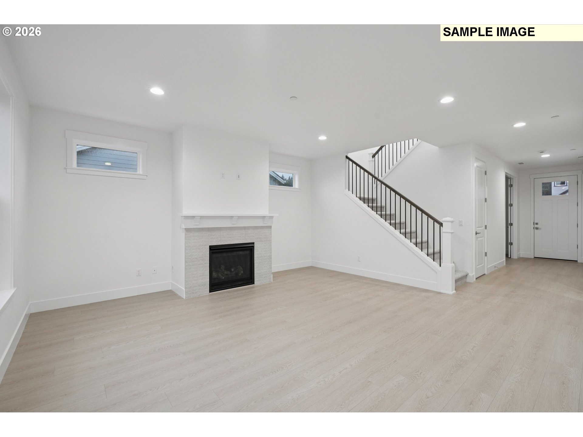 9302 North Clover Street, Unit LOT 267 Camas, WA 98607 - Photo 15 of 33 a view of an empty room with wooden floor and a fireplace