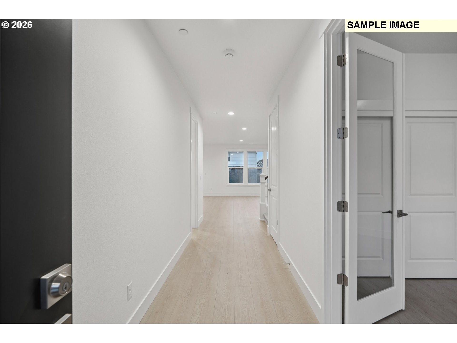 9302 North Clover Street, Unit LOT 267 Camas, WA 98607 - Photo 2 of 33 a view of a hallway with wooden floor