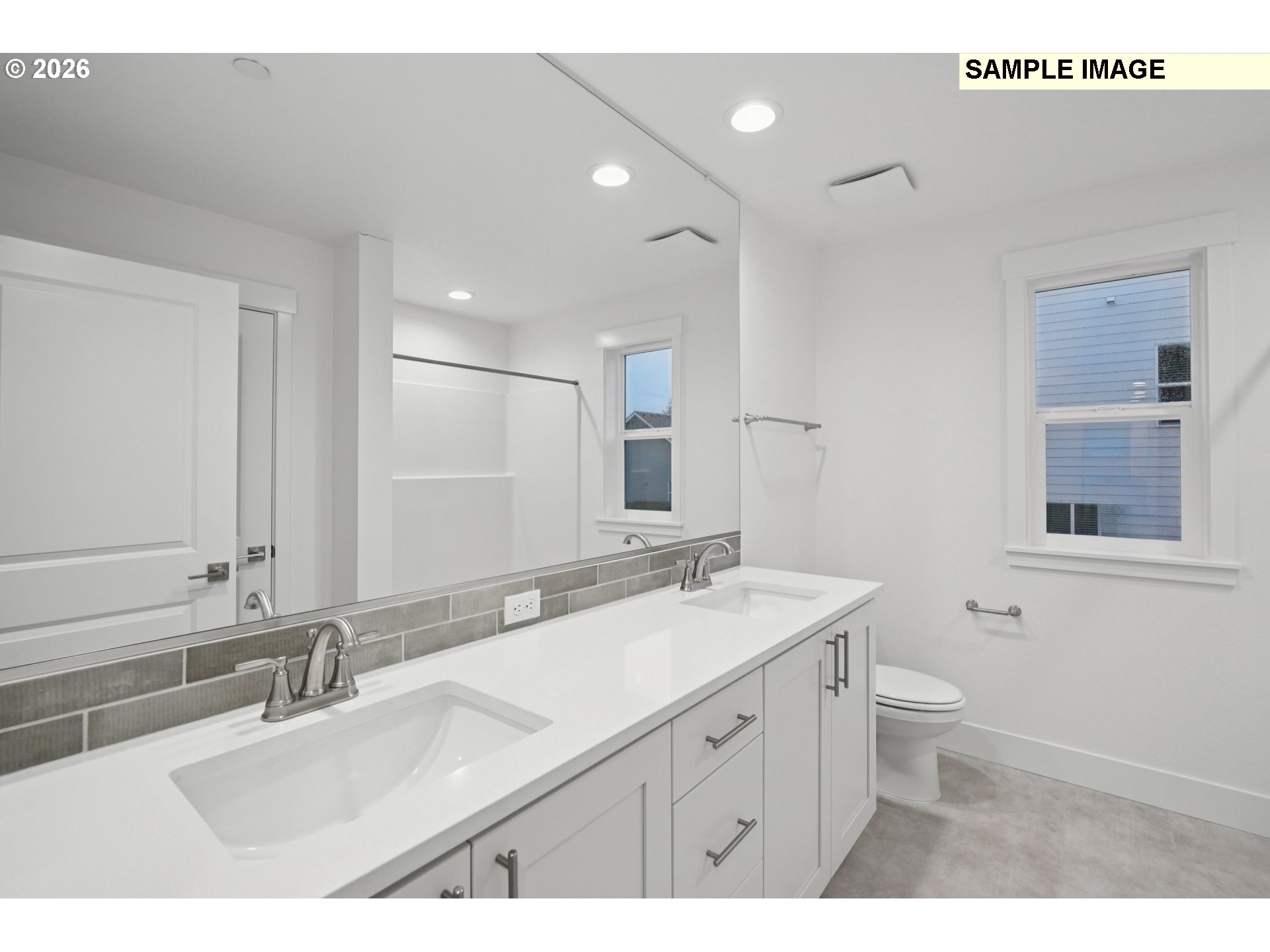 9302 North Clover Street, Unit LOT 267 Camas, WA 98607 - Photo 22 of 33 a bathroom with a double vanity sink mirror and toilet