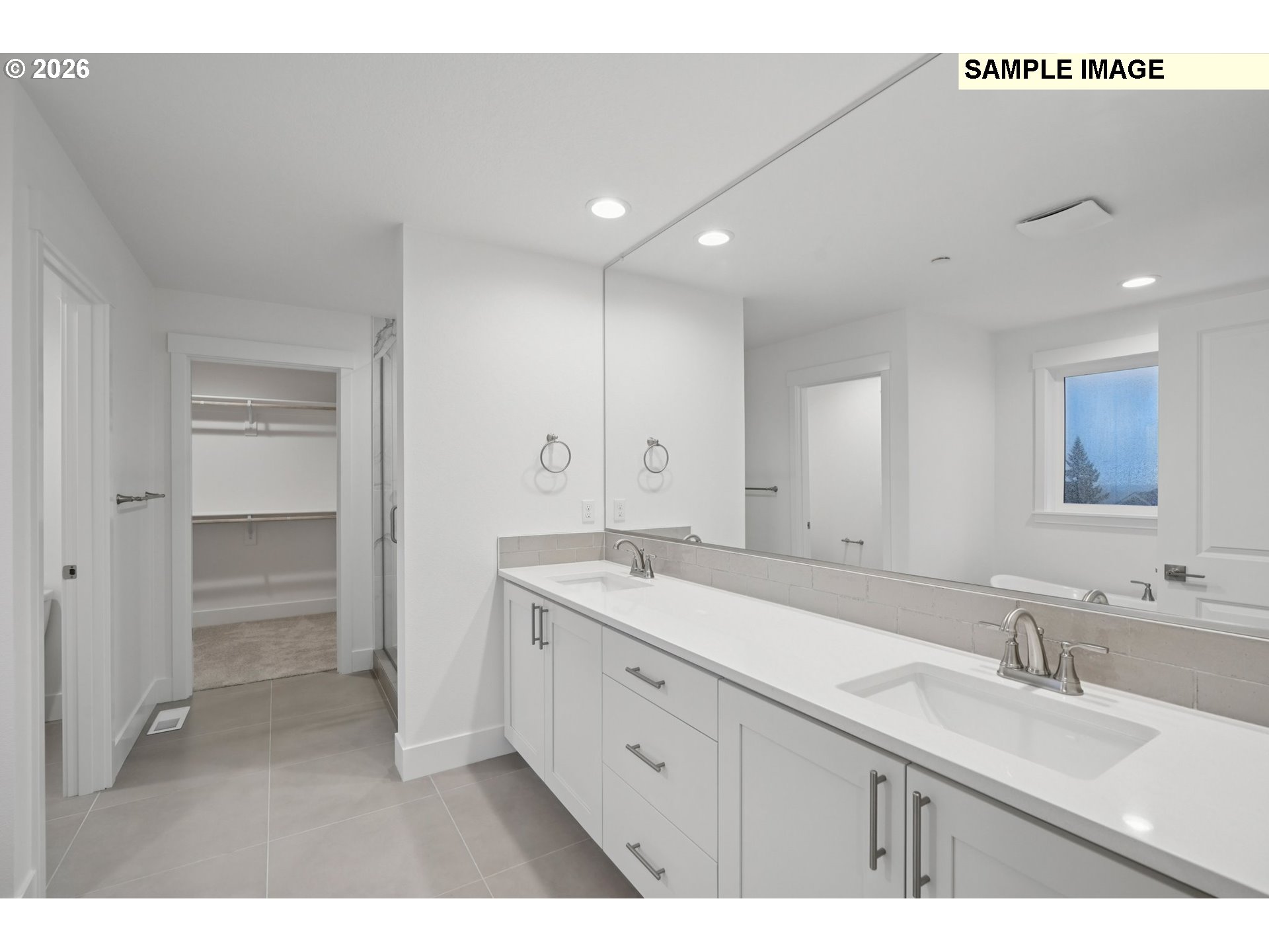 9302 North Clover Street, Unit LOT 267 Camas, WA 98607 - Photo 27 of 33 a spacious bathroom with a granite countertop sink a mirror and a