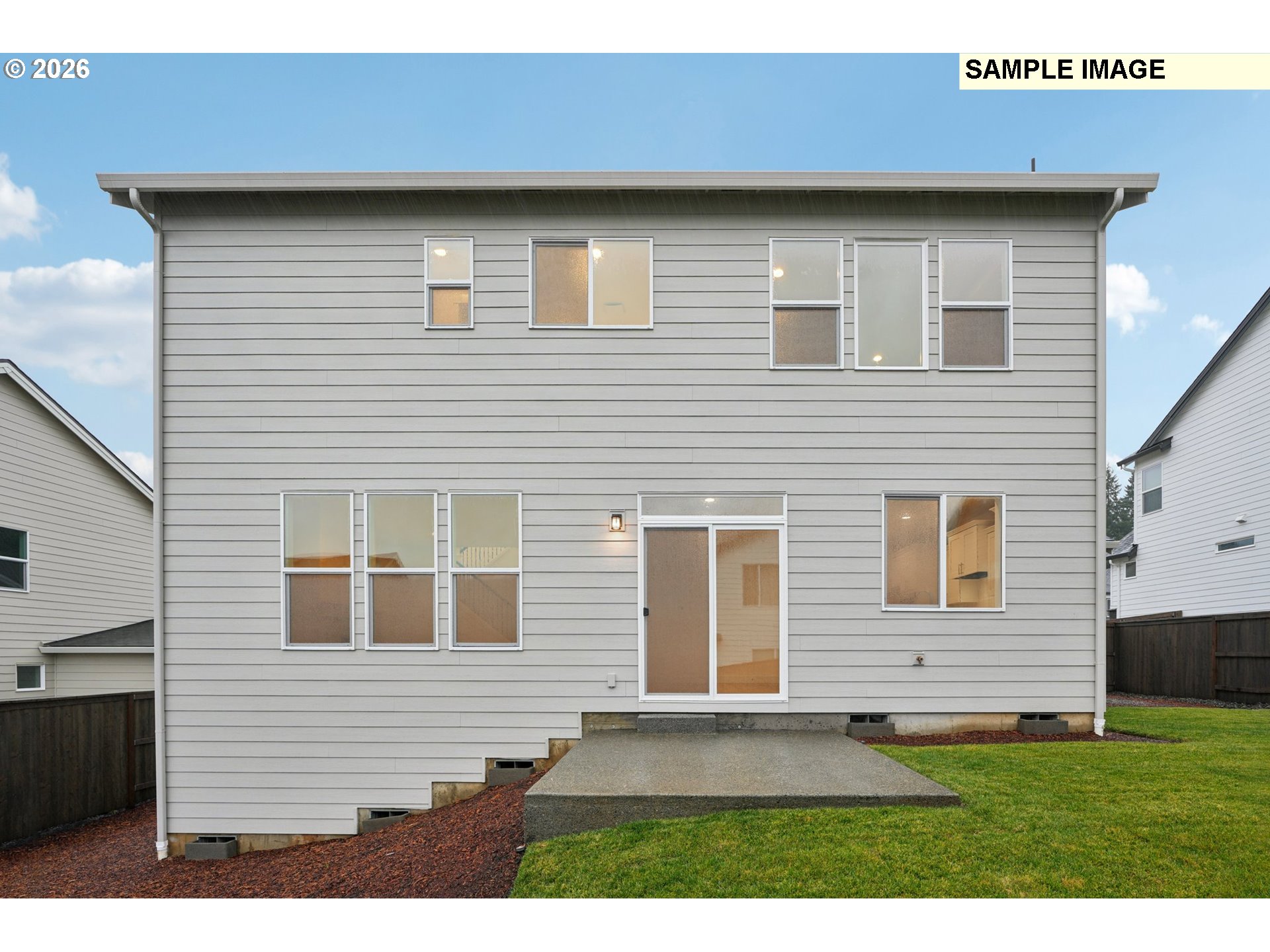 9302 North Clover Street, Unit LOT 267 Camas, WA 98607 - Photo 33 of 33 a brick house with a yard and parking space