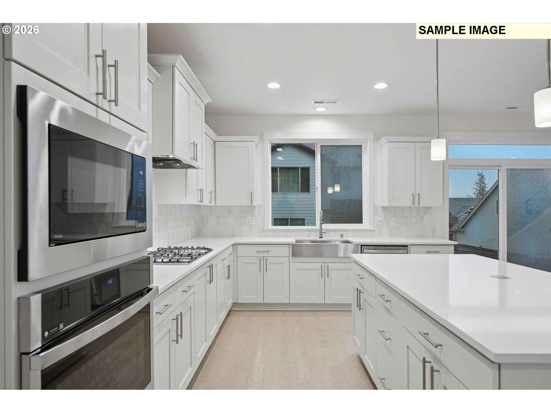 9302 North Clover Street, Unit LOT 267 Camas, WA 98607 - Photo 10 of 33 a kitchen with a sink stove and microwave