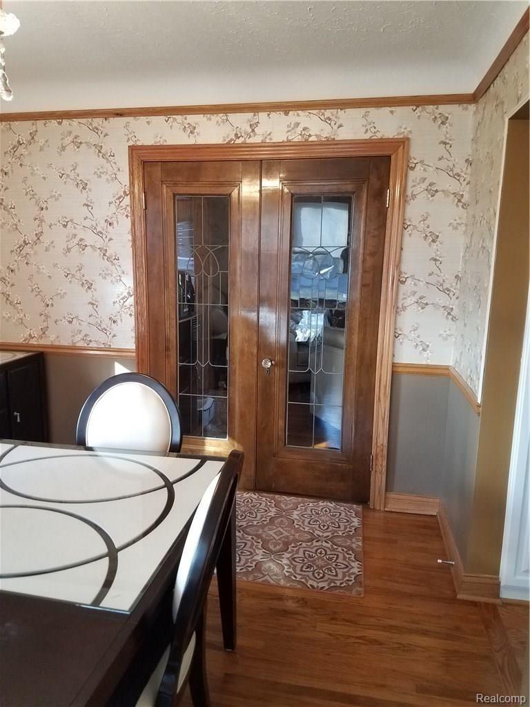 18608 Meridian Road Grosse Ile, MI 48138 - Photo 28 of 31 Dining Room North Leaded Doors.jpg