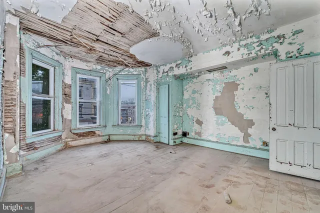 an entryway and livingroom with furniture