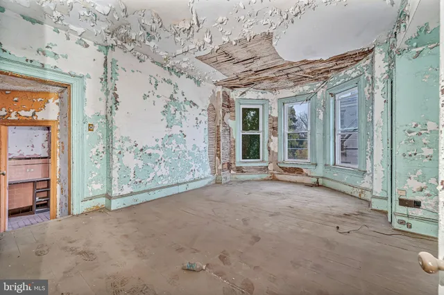 an entryway and livingroom with furniture