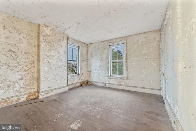 an empty room with windows