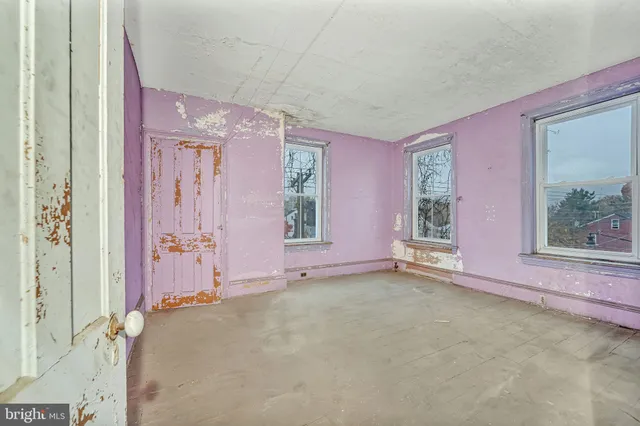 a view of a brick house with a large window