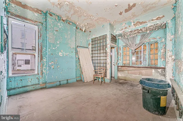 a view of a bathroom with a shower and a sink
