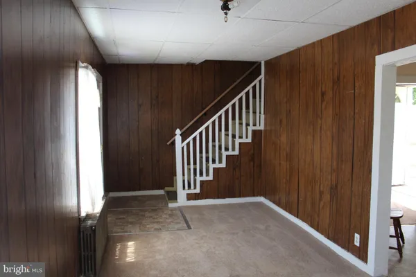 a view of a hallway with stairs