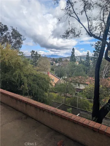 a view of a balcony with an outdoor space
