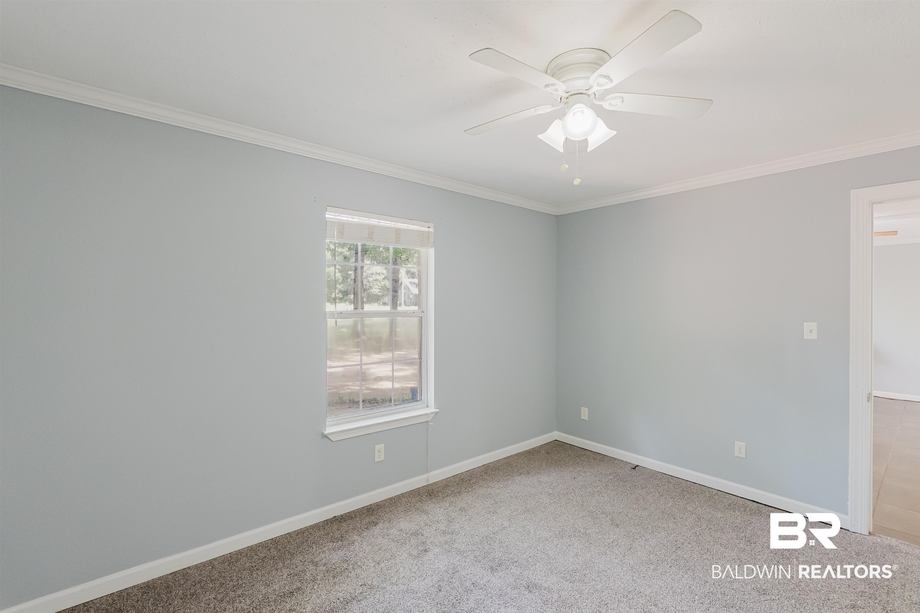 14185 Jackson Lane Foley, AL 36535 - Photo 9 of 16 Unfurnished room with ornamental molding, light carpet, and ceiling fan