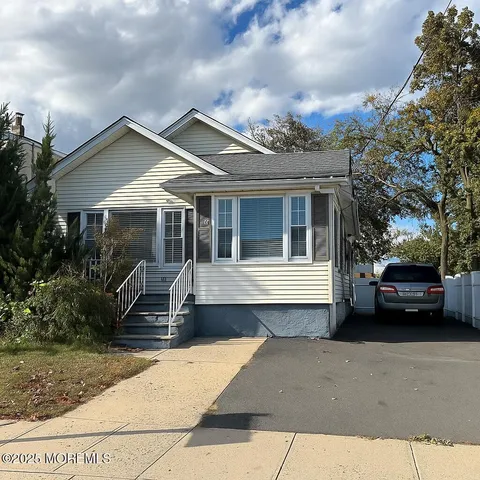 a view of a car park in front of house