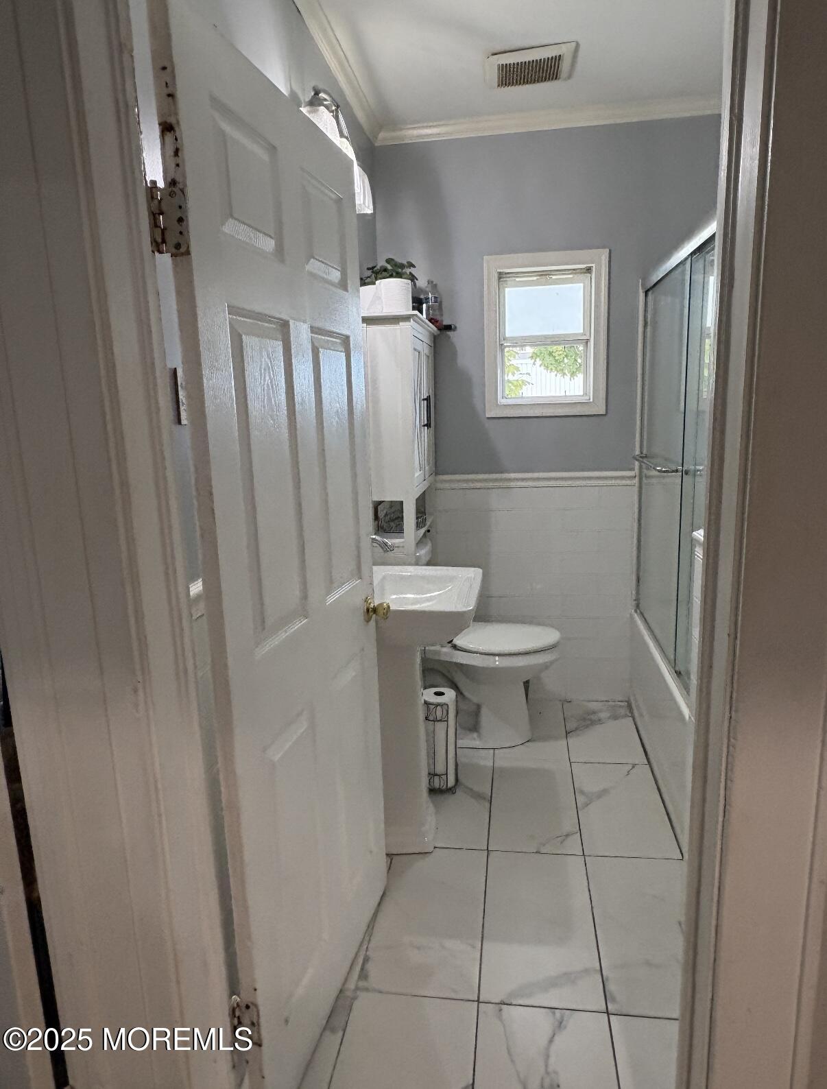 154 Lower Main Street Aberdeen, NJ 07747 - Photo 7 of 10 a bathroom with a sink a toilet and a mirror