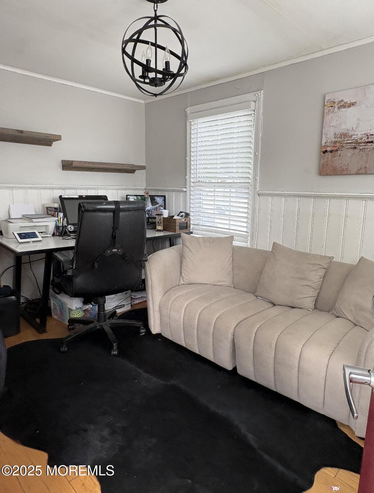 154 Lower Main Street Aberdeen, NJ 07747 - Photo 8 of 10 a living room with furniture a chandelier and a window