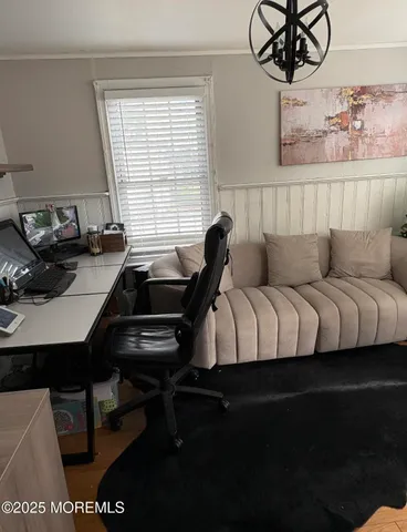 a living room with furniture a couch and a window