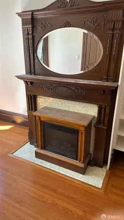 a stove top oven sitting inside of a kitchen